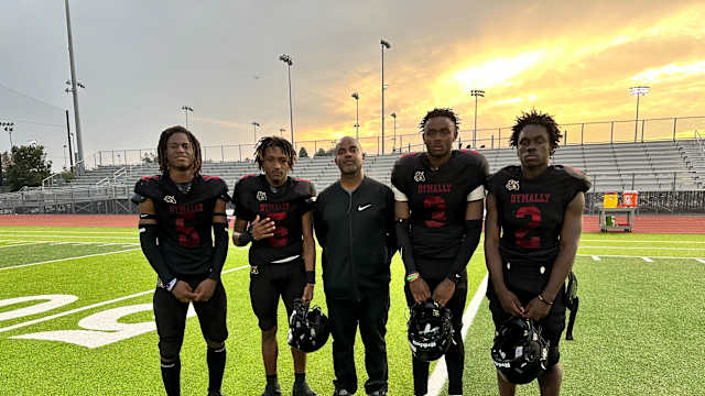 Dymally football's (L-R) Milton Catching, Tramonte Lowe, coach David Wiltz, Bryant Collins, Jermaine Whiten.